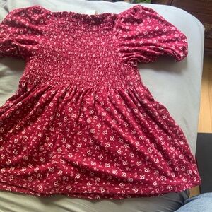 Red with white flowers top off the shoulders